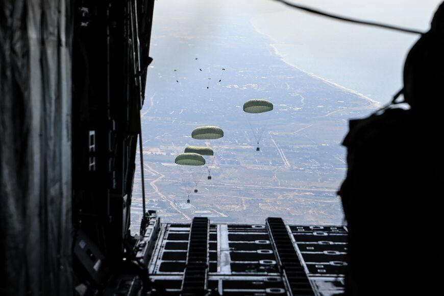 Humanitarian aid is airdropped from military aircraft over the Gaza Strip