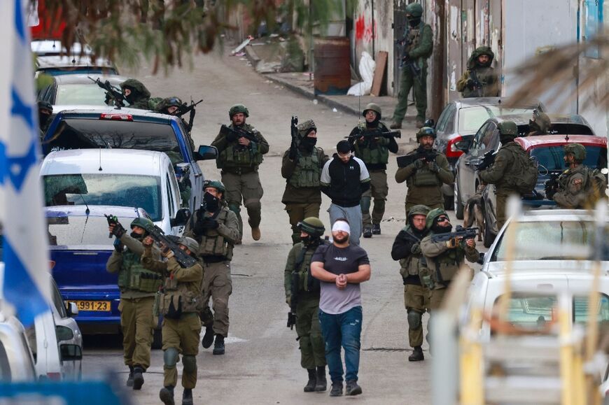 Israeli forces raid the West Bank's Amari refugee camp amid soaring violence in the occupied territory