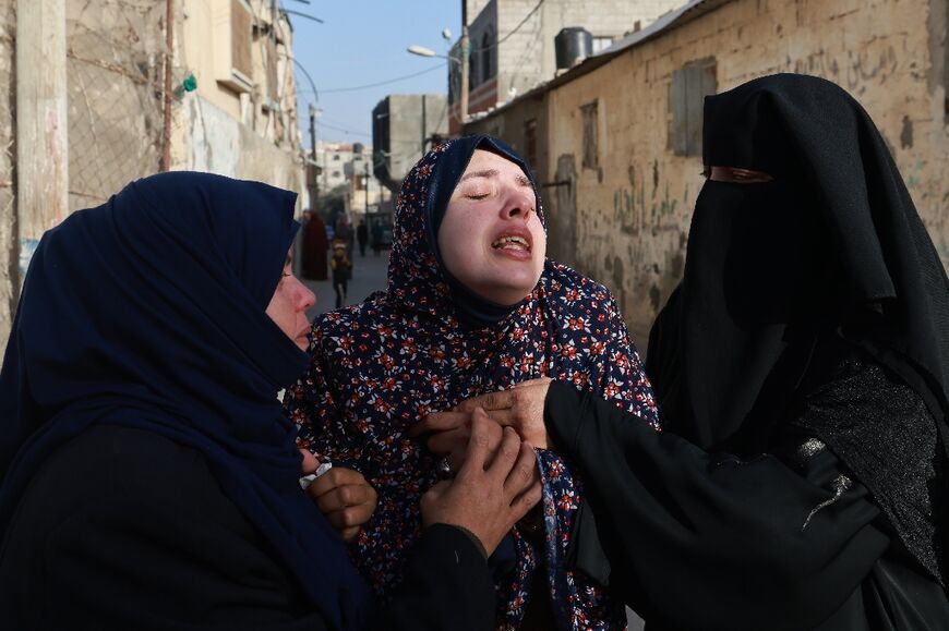 Rania Abu Anza, the mother of twin babies Naeem and Wissam, killed in an Israeli air strike, mourns their death ahead of their burial in Rafah in the southern Gaza Strip