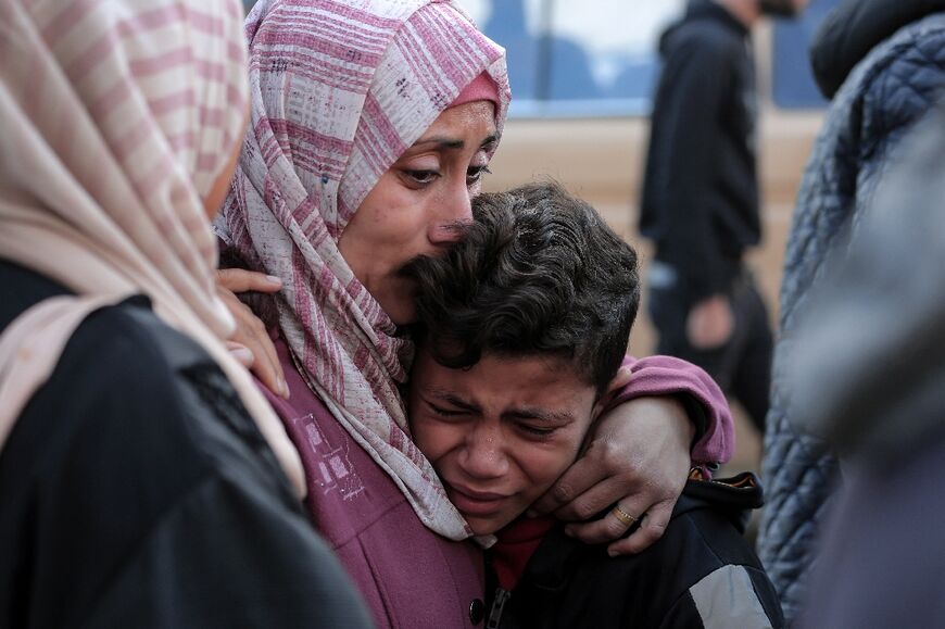 Palestinians at a hospital in Deir al-Balah, central Gaza, mourn a family member killed in Israeli strikes on the makeshift al-Mawasi camp for displaced people west of Khan Yunis city               