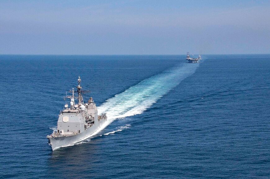 A US Navy guided-missile cruiser transits the Strait of Hormuz