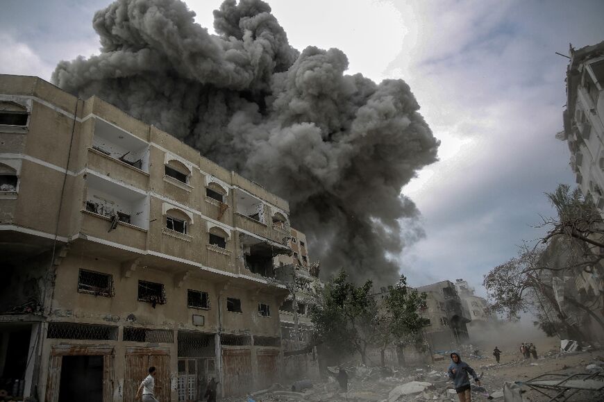 An AFP journalist witnessed air strikes on the area around Gaza City's Al-Shifa hospital, with hundreds of Palestinians fleeing their homes