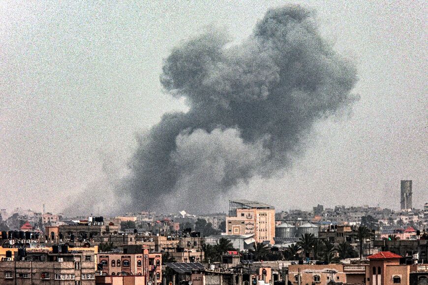 A smoke plume is seen during Israeli bombardment on Khan Yunis in the southern Gaza Strip on March 29, 2024, amid ongoing battles between Israel and the Palestinian militant group Hamas