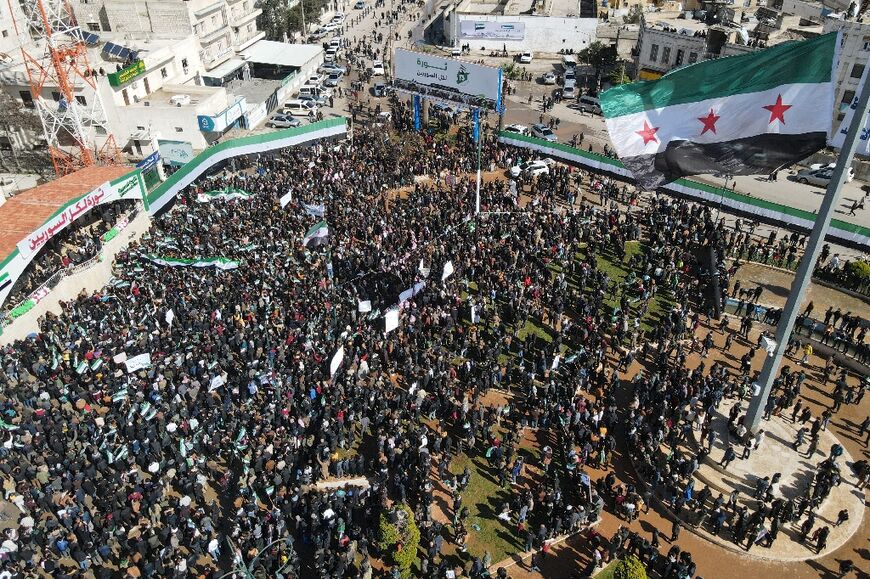 The Syrian rebel flag flying in Idlib, where protesters were also angry at the harsh rule of jihadists