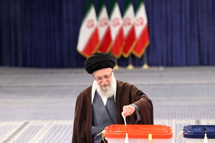 Supreme leader Ayatollah Ali Khamenei casts his ballot, appealing for citizens to do the same because Iran's 'enemies want to see if the people are present'