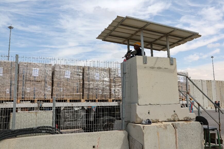 A truck carrying humanitarian aid for Gaza awaits clearance at the Kerem Shalom border crossing