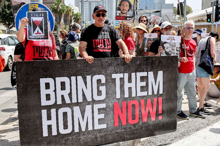 Relatives of Israeli hostages held in Gaza protest outside the Defence Ministry headquarters in Tel Aviv