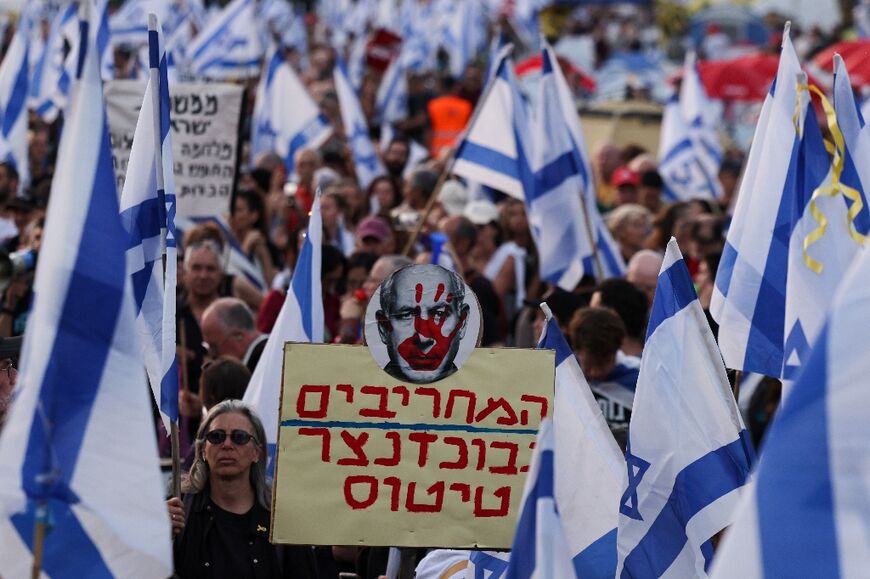 Israeli anti-government protesters rally in front of parliament demanding premier Benjamin Netanyahu resign