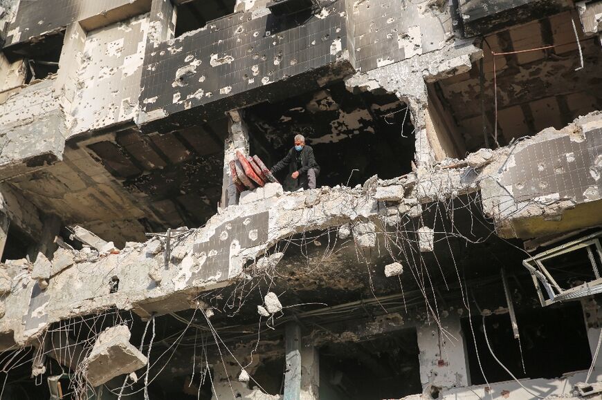 A Palestinian inspects the damage at Gaza's Al-Shifa hospital after the Israeli military withdrew