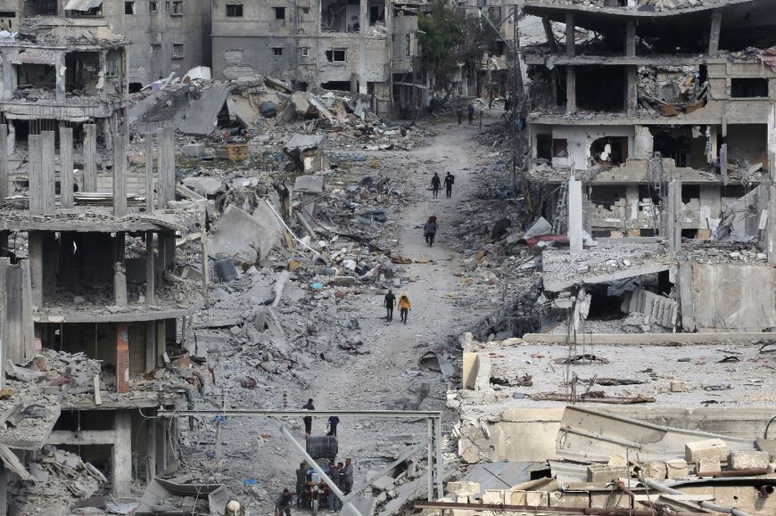 Gazans returning to the city of Khan Yunis confronted mounds of rubble where houses and shops once stood