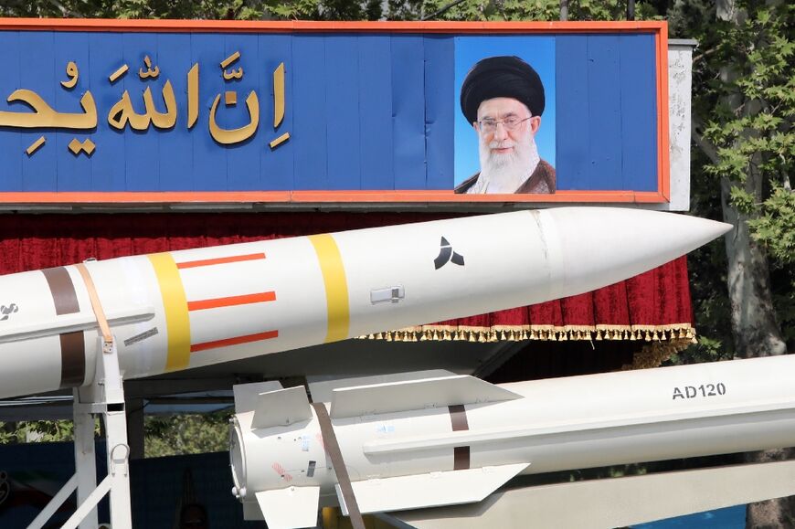 An Iranian military truck carries a Sayad 4-B missile past a portrait of supreme leader Ayatollah Ali Khamenei during a military parade on April 17, 2024