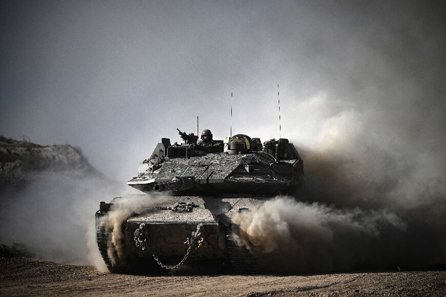 An Israeli army battle tank moves along the border with the Gaza Strip and southern Israel on April 2, 2024 