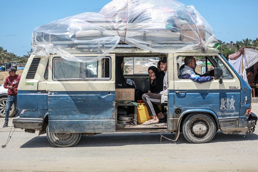 Displaced Palestinians arrive in Gaza's Khan Yunis after leaving Rafah following an Israeli evacuation order