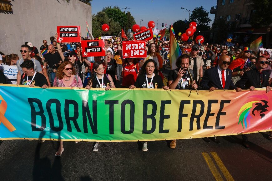 Marchers alternated between chants for equal rights for the LGBTQ community and those for the hostages's release.