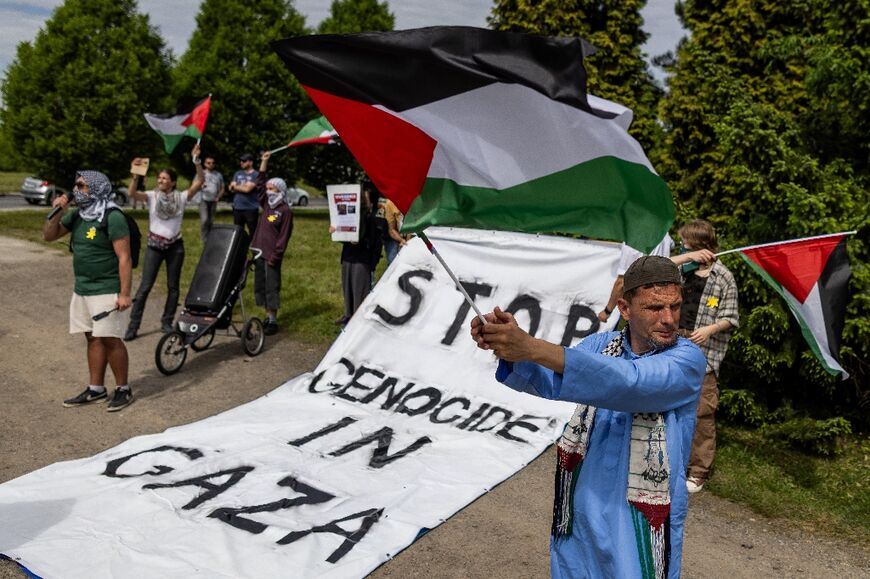 Demonstrators waving Palestinian flags during the March of The Living