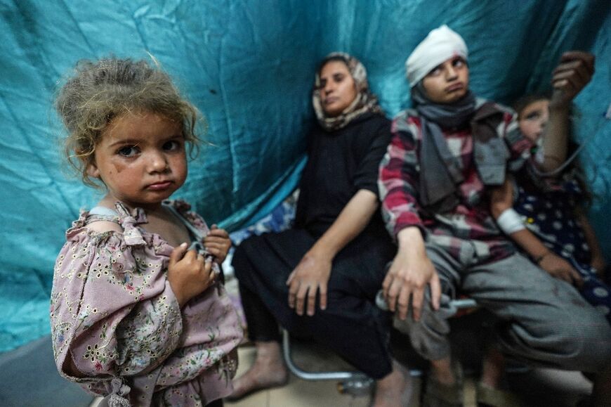 Palestinian children wounded in Israeli strikes arrive for treatment at Gaza's Al-Aqsa Martyrs Hospital in Deir al-Balah on May 25, 2024