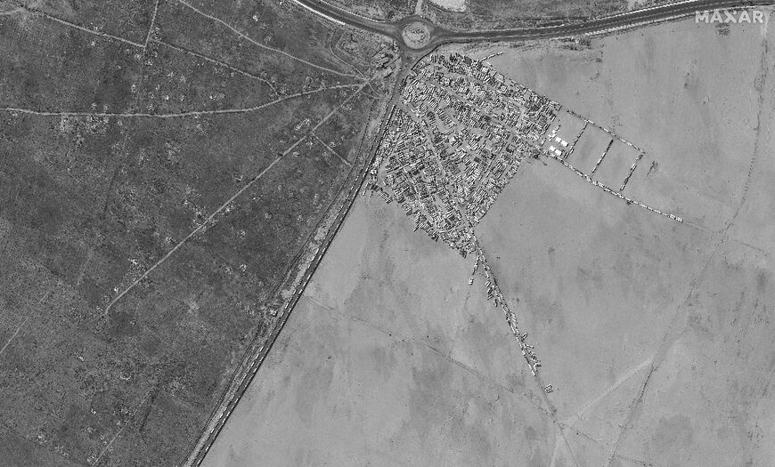 Trucks with aid wait on the Egyptian side of the Rafah crossing with Gaza, in this satellite image courtesy of Maxar Technologies taken on May 7, 2024