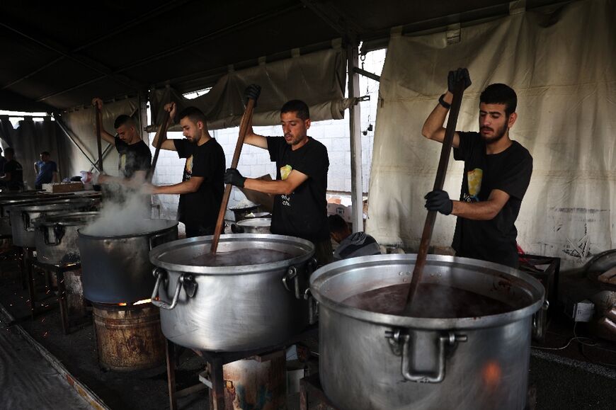 US-based charity World Central Kitchen has resumed its work in Gaza after an Israeli drone strike killed seven of its staffers -- local WCK volunteers cook meals for needy Palestinians in Rafah 