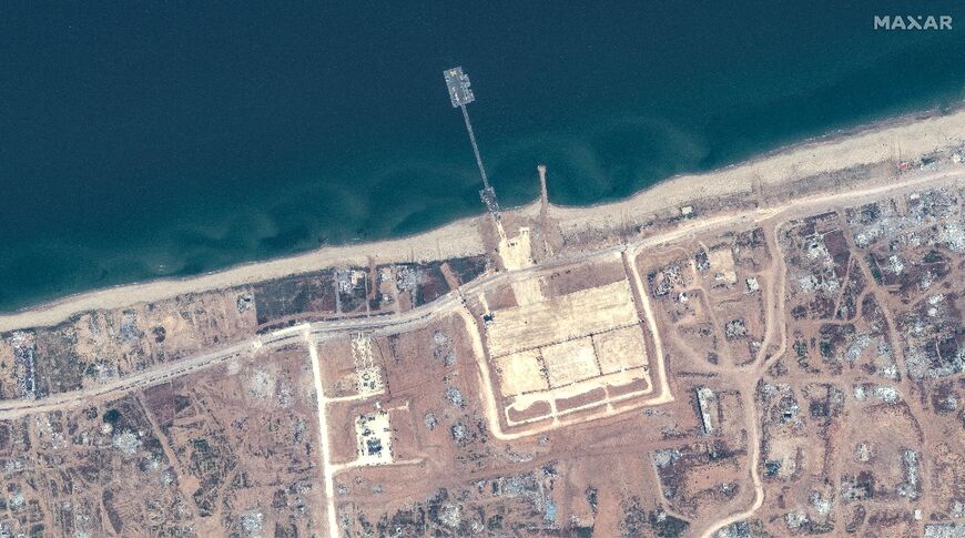 A handout satellite image courtesy of Maxar Technologies shows the US-built Trident Pier on the Gaza coast lined up nearby