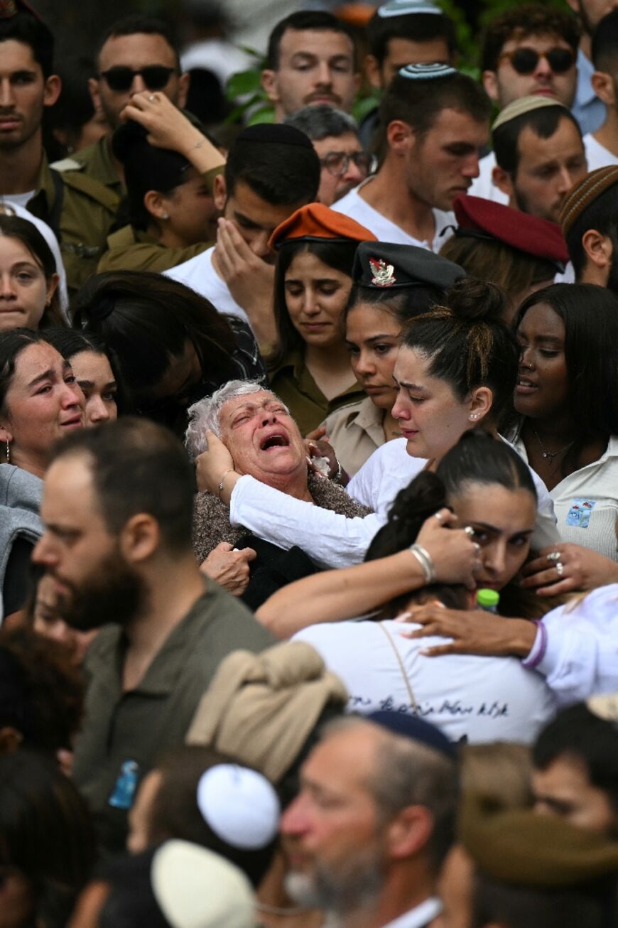 Israelis mourn during a cemermony at Jerusalem's Mount Herzl military cemetery on May 13, 2024, marking Memorial Day for fallen soldiers 