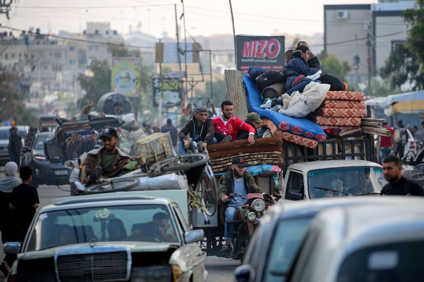 Displaced Palestinians flee Rafah for safer areas on May 7, 2024