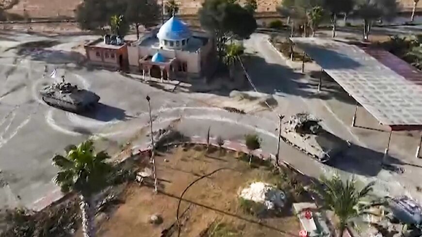 In this image grab from video released by the army, Israeli tanks  are seen entering the Palestinian side of the Rafah border crossing between Egypt and Gaza, the main entry point for aid deliveries to the besieged territory