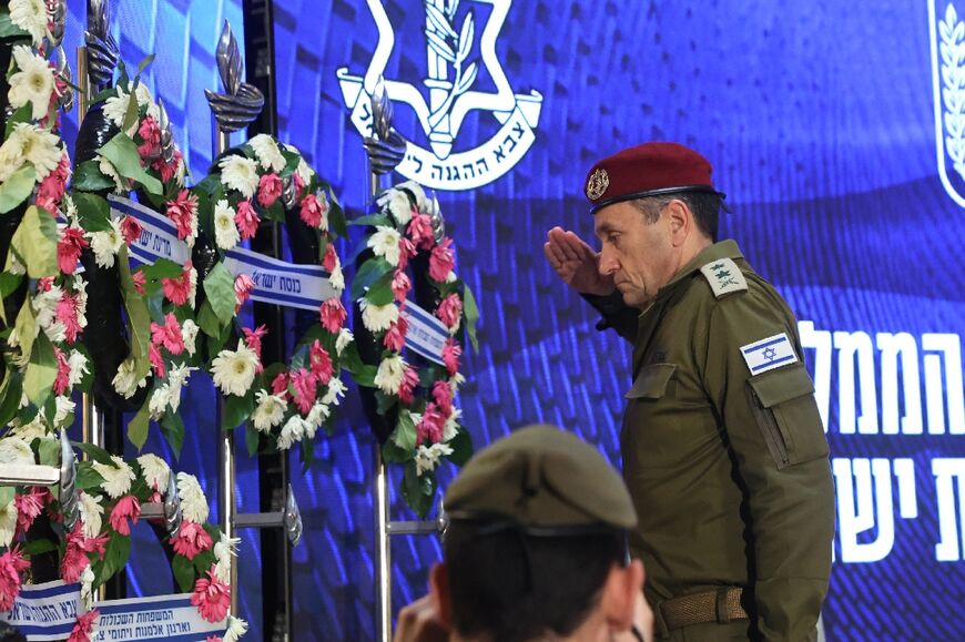 Israelis stood still with their heads bowed in contemplation for two minutes, until the roar of a fighter jet broke the silence