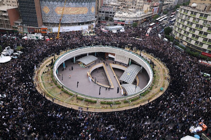 Iranians gather at Valiasr Square in central Tehran to mourn the death of President Ebrahim Raisi and Foreign Minister Hossein Amir-Abdollahian 