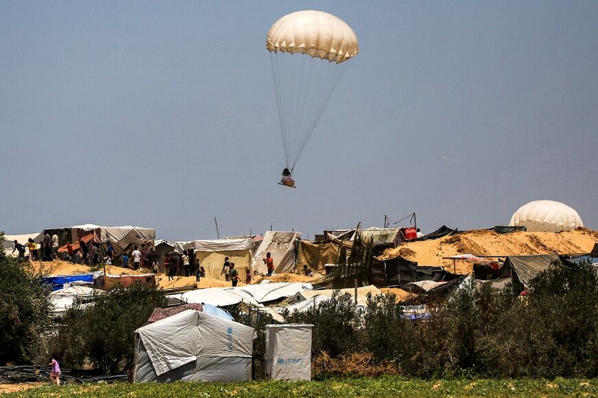 Humanitarian aid dropped on Khan Yunis falls near tents sheltering Palestinians displaced by conflict 