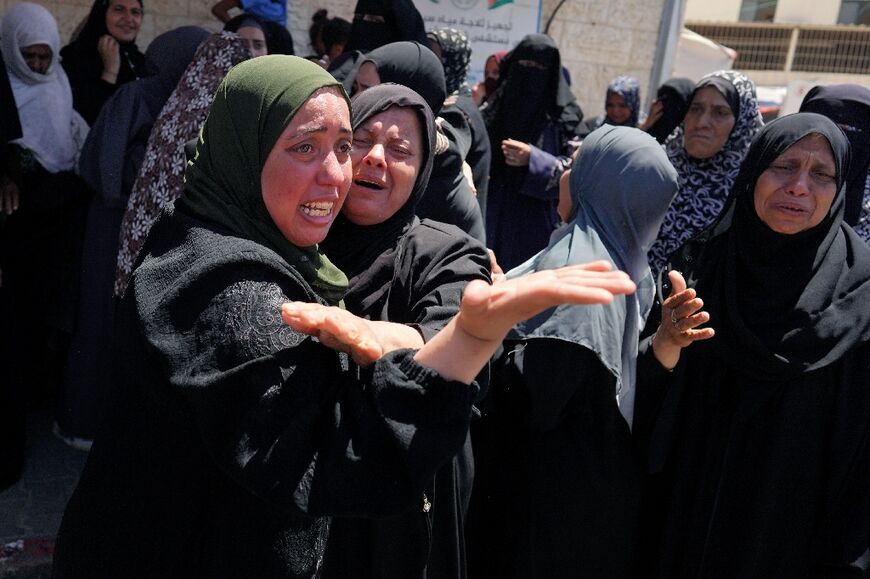 Family members mourn a man who succumbed to his wounds after Israeli bombardment, at the al-Aqsa Martyrs Hospital in Deir al-Balah, central Gaza Strip, on June 11, 2024