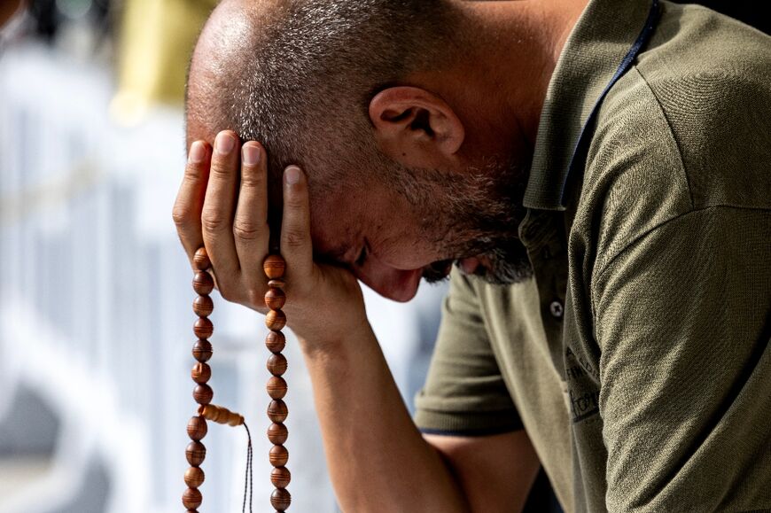 A pilgrim prays at the Grand Mosque in Mecca