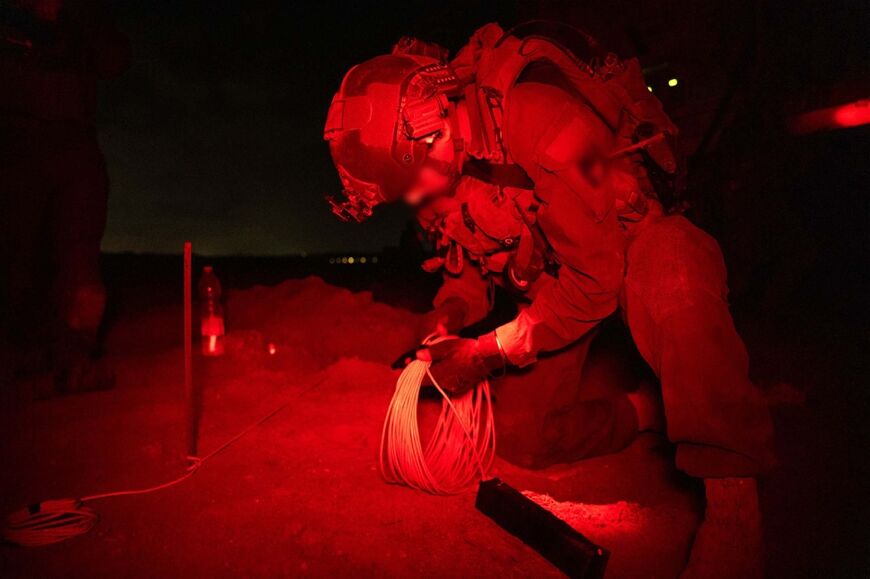 This handout picture released by the Israeli army on May 7, 2024 reportedly shows Israeli soldiers dismantling a tunnel in the area of Beit Hanun in the northern Gaza Strip