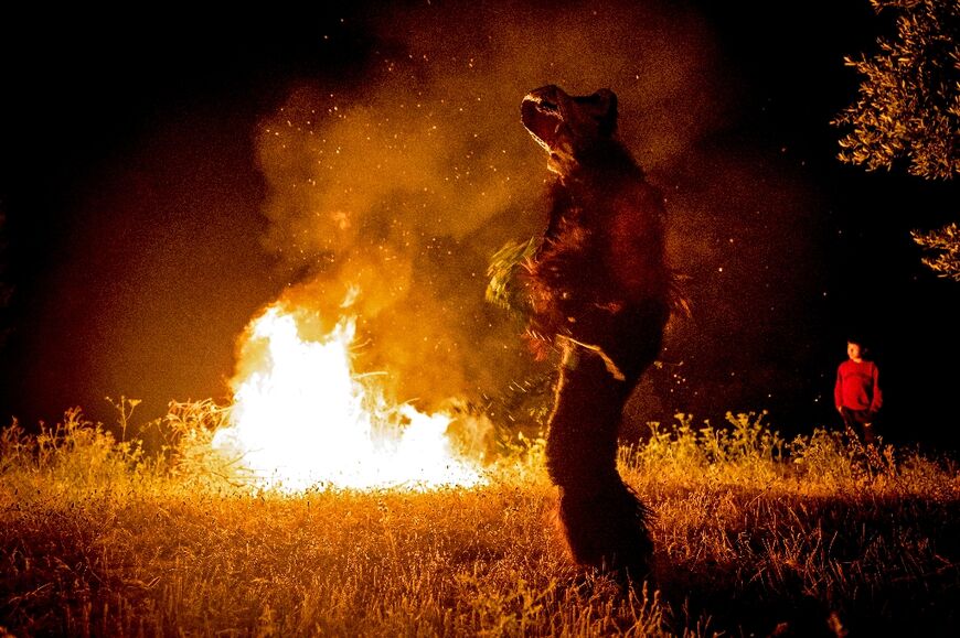 A dancer dressed as a Pan-like figure, half goat, half man, performs during the annual Joujouka Musical Festival 