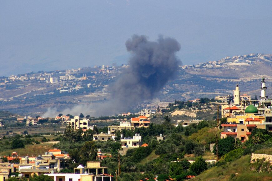 Smoke billows following an Israeli air strike on the south Lebanon town of Siddikine