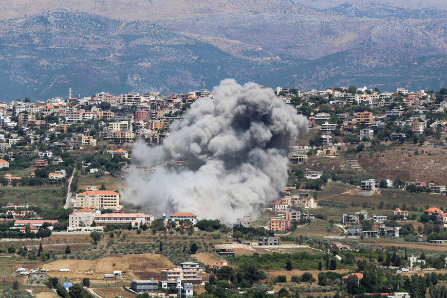 Smoke billows from the site of an Israeli airstrike that targeted the southern Lebanese village of Khiam near the border with Israel on June 25, 2024. Fallout from the Gaza war is regularly felt on the Israel-Lebanon frontier, where deadly cross-border exchanges have escalated between Israeli troops and Hezbollah fighters. (Photo by RABIH DAHER / AFP) (Photo by RABIH DAHER/AFP via Getty Images)