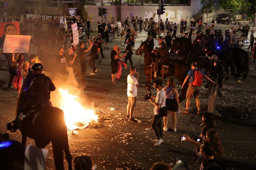 Mounted Israeli police try to disperse a demonstration by relatives and supporters of Israelis held hostage by Palestinian Hamas militants in Gaza since the October 7 attacks, in Tel Aviv early on June 2, 2024