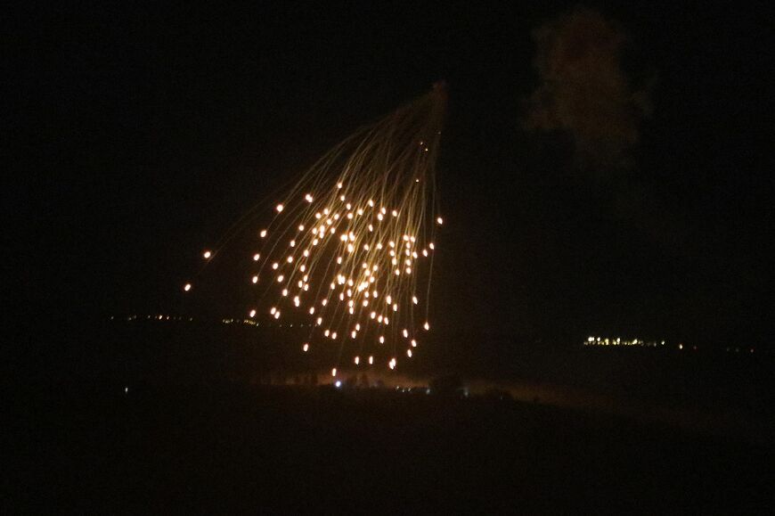 An Israeli strike illuminates the sky above the southern Lebanese village of Khiam late on April 17, 2024, amid ongoing cross-border tensions as fighting continues between Israel and Hamas militants in the Gaza Strip