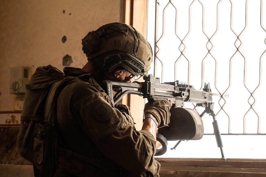 This picture released by the Israeli army shows a soldier taking part in military operations in an unspecified area of Gaza