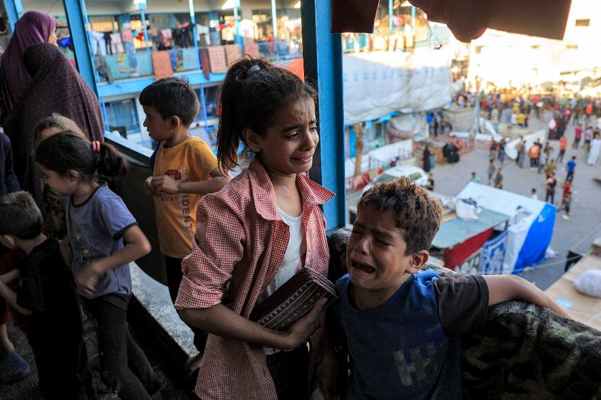 Children at the UN-run Al-Jawni school after the Israeli strike