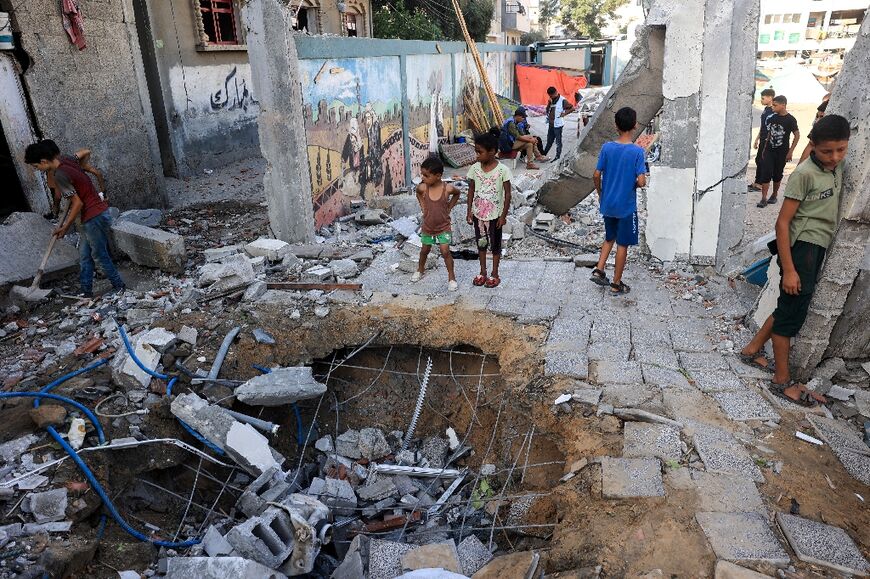 Children at a UN-run school turned shelter in central Gaza's Nuseirat after Israel struck it