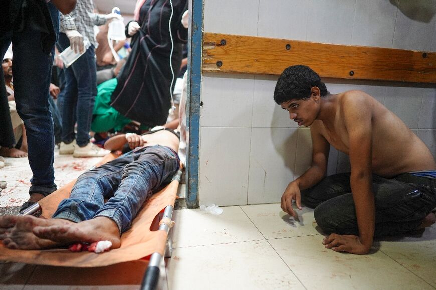 People injured during Israeli bombardment await treatment at Nasser hospital in Khan Yunis in the southern Gaza Strip on July 9, 2024