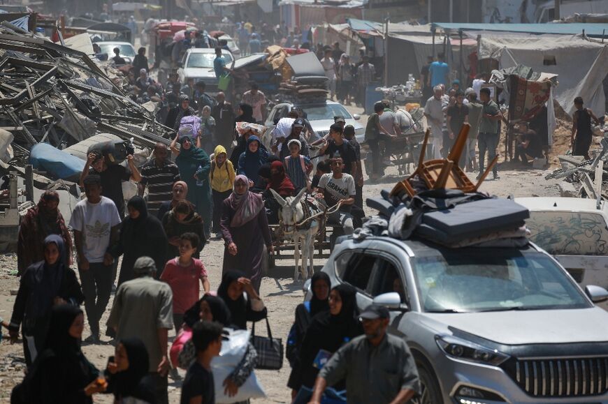 Palestinian civilians move away from the eastern districts of Khan Yunis in the southern Gaza Strip following evacuation orders