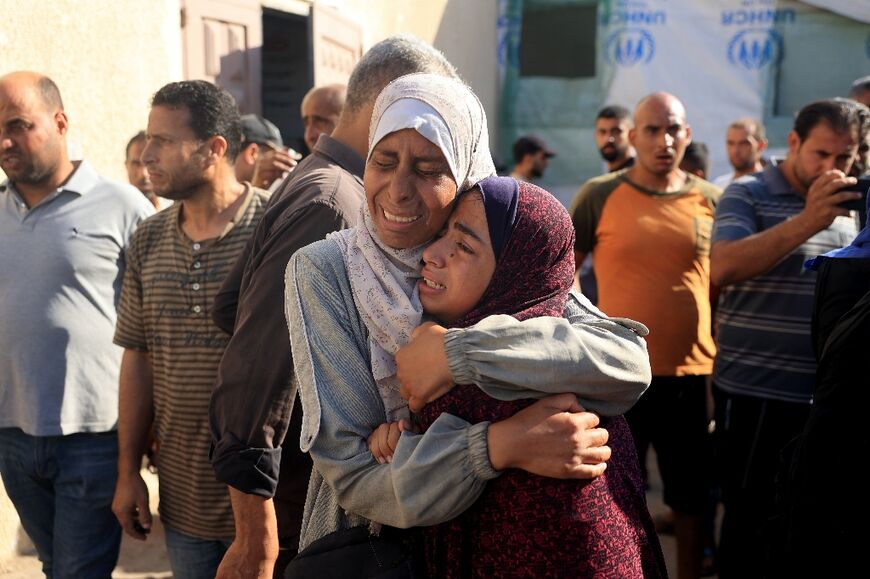 Palestinians mourn over the bodies of loved ones following Israeli bombardment in Deir el-Balah in the central Gaza Strip on July 10, 2024