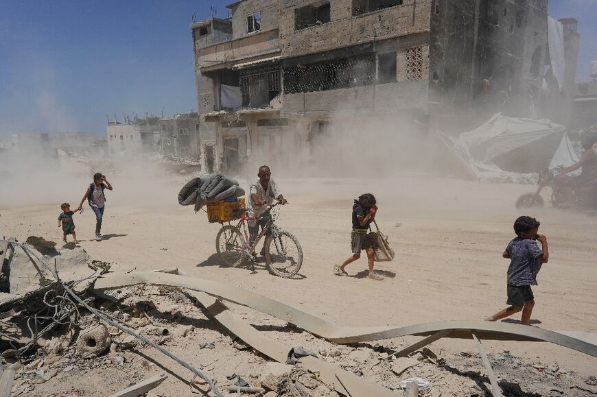 Displaced Palestinians return to Bani Suhayla and neighbouring towns east of Khan Yunis following the withdrawal of Israeli forces from the area in the southern Gaza Strip