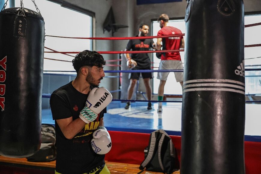 Waseem Abu Sal trains at a gym in Ramallah city in the occupied West Bank but his Cairo-based coach cannot visit him