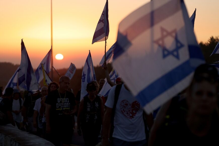 Families and supporters of Israeli hostages held by Hamas on a protest march towards Jerusalem on July 11, 2024