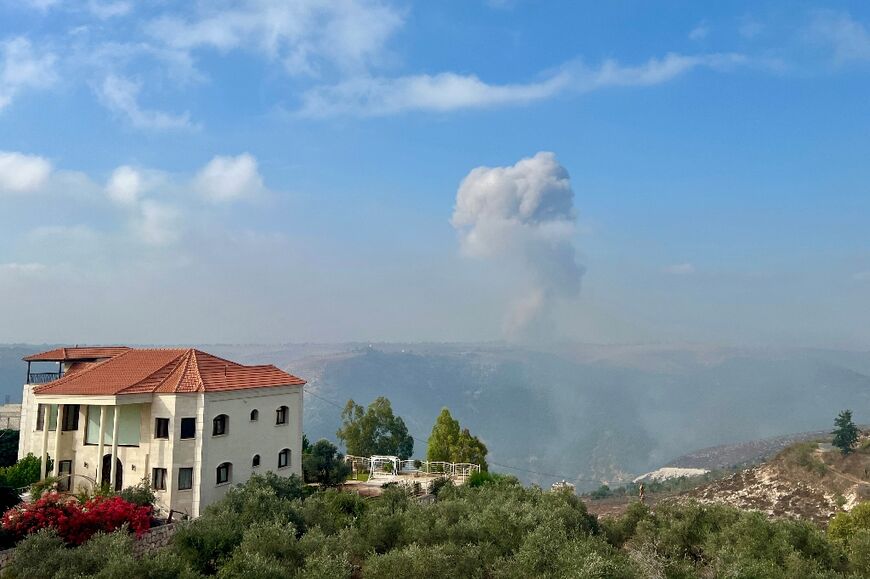 Smoke billows from an area targeted by an Israeli airstrike in the southern Lebanese village of Qsair