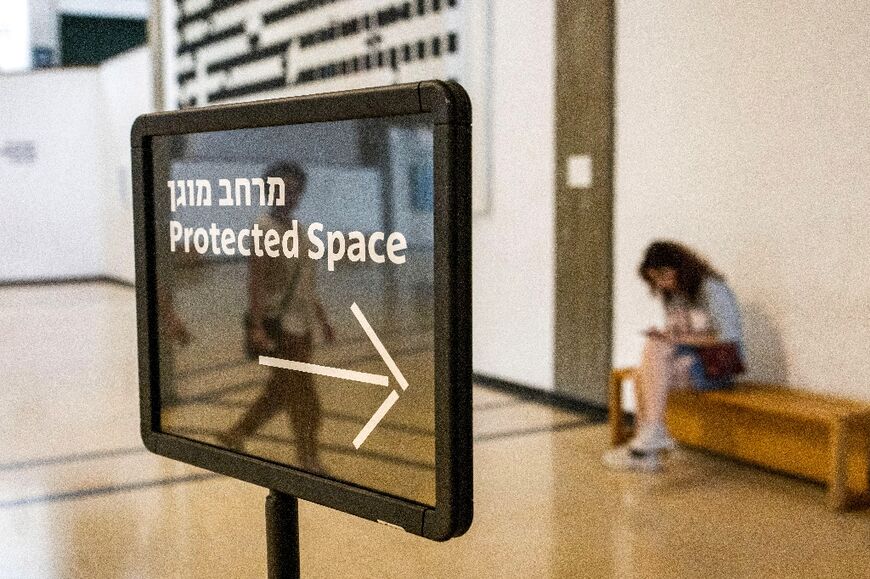 A sign points visitors to a "protected space" at the Tel Aviv Museum of Art 