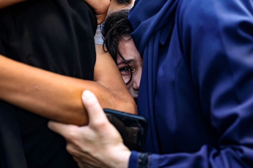 A young girl cries after a relative was killed in an Israeli strike in Gaza City