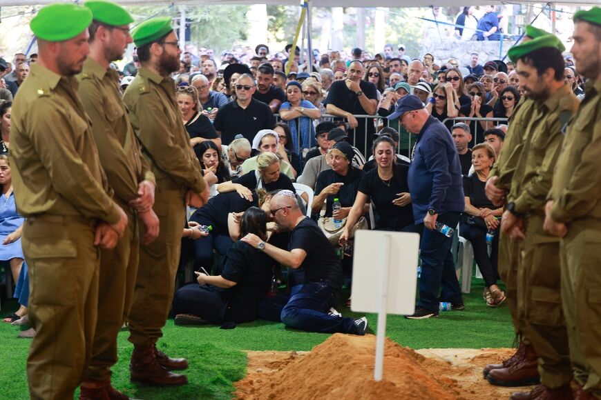 Relatives of Israeli soldier Mordechai Yosef Ben Shoam, killed with another soldier in the Gaza Strip, mourn during his funeral at Mount Herzl military cemetery in Jerusalem 